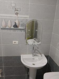 a bathroom with a sink and a mirror at Melia house in Marsa Alam City