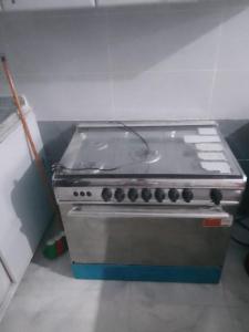 a stove top oven in a kitchen with at Melia house in Marsa Alam City