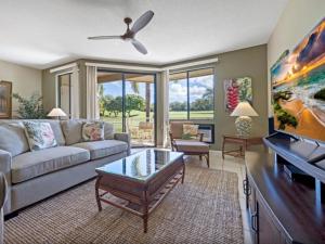 a living room with a couch and a table at Wailea Grand Champions 97 in Wailea