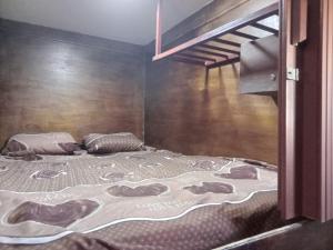 a bedroom with a bed and a bunk bed at Petra cabin Roof top hostel in Wadi Musa +101 photos