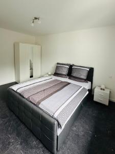 a bedroom with a large bed in a room at Apartment in Rittersdorf in Rittersdorf +8 photos