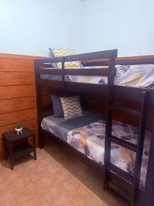 a couple of bunk beds in a room at Campo Adentro Cabin 2 Private Jacuzzi in Aguada