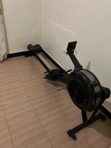 a room with a stand up exercise machine at Friendly House in Arusha +3 photos