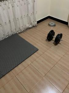 a pair of dumbbells on the floor in a room at Friendly House in Arusha