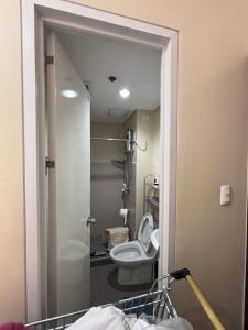 a bathroom with a toilet and a sink at New Centrio Tower Lovely Studio adj Ayala CDO in Cagayan de Oro +20 photos