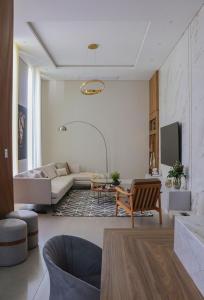 a living room with a couch and a tv at Loft do Edu in Ortigueira