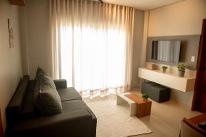 Χώρος καθιστικού στο Apto c 2 suites e Lazer Completo a 100m da Praia