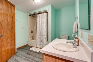 a bathroom with a sink and a shower at 1 Mi to Main St! Family Farmhouse in West Unity in Holiday City +22 photos