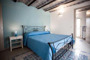 Postel nebo postele na pokoji v ubytování Palazzo Pagliaro