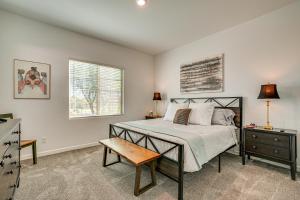 a bedroom with a bed and a table and a window at Mtn Views and Private Hot Tub Buckeye Getaway in Perryville