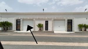 a kite in the street in front of a building at شاليه ليالي الفندقيه in Taif