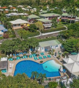 an aerial view of a resort with a swimming pool at L'Odyssée - 3 pièces, piscine et mer, idéalement situé in Le Diamant +18 photos