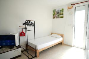 Ένα ή περισσότερα κρεβάτια σε δωμάτιο στο Vila Brca