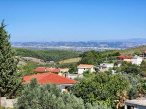 a small town with red roofs and trees at Bujtina Ismet Gjeli 