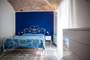 Postel nebo postele na pokoji v ubytování Palazzo Pagliaro