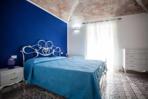 Postel nebo postele na pokoji v ubytování Palazzo Pagliaro