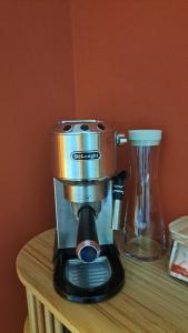 a coffee maker sitting on top of a table at Jolie chambre en cœur de ville in Thouars