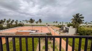 a view of the beach from a balcony at Apto com 2 Suites, Piscina e Jogos a 100m da praia in São Bento