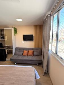 Et tv og/eller underholdning på 47A Studio Aconchegante no Brás - Com Piscina