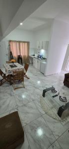 a living room with a table and a kitchen at Modern apartment next to the Eldorado Casino in Eldorado