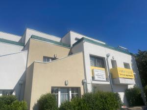 a building with a sign on the side of it at Schwavillage in Schwadorf