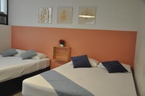 Giường trong phòng chung tại Laureles, casa completa y amplia para grupos grandes +15 ảnh