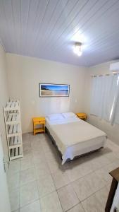 Postel nebo postele na pokoji v ubytování Residencial Praia da Daniela