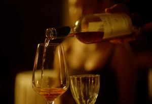 a person pouring wine into a wine glass at Ati Ambavi Botique Hotel Gudauri in Gudauri +129 photos
