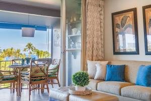 a living room with a couch and a table at Eldorado K203 · EL K203 2BD Condo w AC Pool Beach Cabana in Kahana