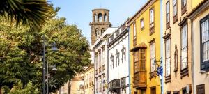 a city street with a clock tower in the background at Casa Anik Boutique Home, La laguna in Las Lagunas