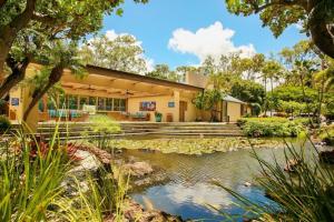 a house with a pond in front of it at Sands of Kahana 354 · SK 354 Updated Maui OceanFront 2BD w Ocean in Kahana