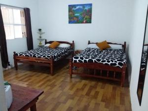 Una cama o camas en una habitación de Hotel NO STRESS TRAVELLERS