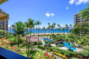 an aerial view of a resort with a pool and palm trees at Kaanapali Alii 456 · ALII 456 OceanFront Tropical Getaway w Ocea in Kaanapali