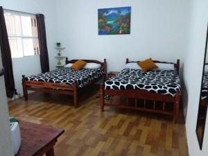 Un pat sau paturi într-o cameră la Hotel NO STRESS TRAVELLERS
