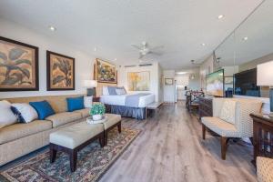 a living room with a couch and a bed at Eldorado K203 · EL K203 2BD Condo w AC Pool Beach Cabana in Kahana