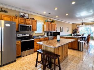 a large kitchen with wooden cabinets and a counter top at Mountainview Majesty in Gatlinburg