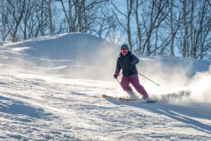a person is skiing down a snow covered slope at Mountainview Majesty in Gatlinburg