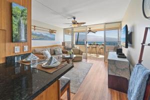 a kitchen and living room with a view of the ocean at Island Sands 210 · IS 210 OceanFront Condo Expansive Ocean Views in Maalaea