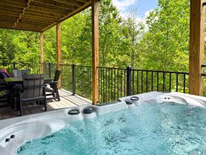 a hot tub on the deck of a house at Mountainview Majesty in Gatlinburg
