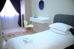 Ένα ή περισσότερα κρεβάτια σε δωμάτιο στο Damai Guest House