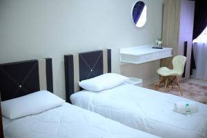 Ένα ή περισσότερα κρεβάτια σε δωμάτιο στο Damai Guest House