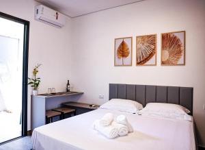 เตียงในห้องที่ Vila das Aguas Ilhabela +63 ภาพ