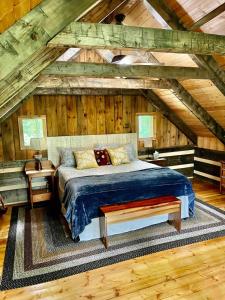 a bedroom with a bed in an attic at Honeymoon Cabin in McEwen