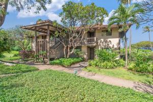 a house with a balcony and a yard at Kaanapali Plantation 58 · KPL 58 Spacious 2BD Plantation Home Ne in Lahaina