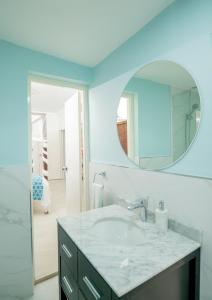 a bathroom with a sink and a mirror at Culloden Cove in Whitehouse