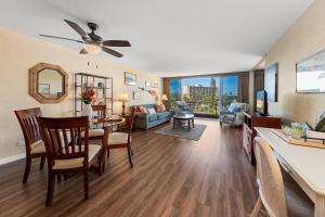 a living room with a table and chairs and a living room at Maui Kaanapali Villas 415 · MKV 415 Updated Condo w Ocean View a in Kahana