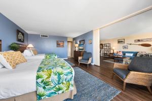 a bedroom with a large bed and a living room at Maui Kaanapali Villas 415 · MKV 415 Updated Condo w Ocean View a in Kahana +43 photos