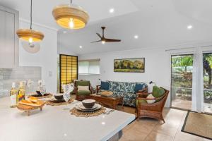 a living room with a couch and a table at International Colony Club 16 · ICC 16 Plantation Style 2BD Cotta in Lahaina