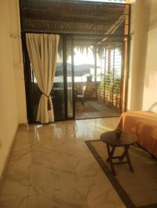 a bedroom with a bed and a table in a room at playa pescador apart hotel in Santa Fe