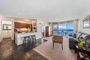 a kitchen and living room with a view of the ocean at Royal Kahana 909 · RK 909 OceanFront Condo w Beautiful Ocean Vie in Kahana